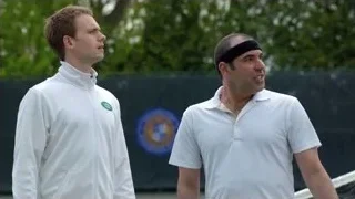 two men talking on tennis court — Suits