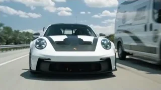 white Porsche 911 GT3 RS driving on highway — Sports Cars