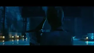 person standing in pool of water at night — John Wick