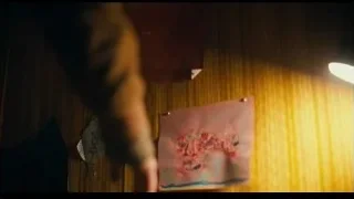 person's hand on wooden table — Joker