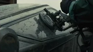 person working on car with power tool — Blade Runner 2049