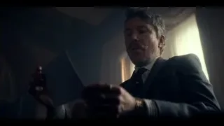 man in suit holding book in dim room — Peaky Blinders