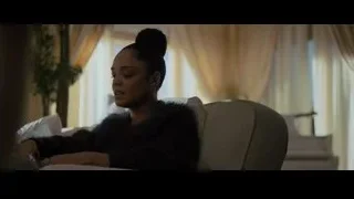 woman sitting in armchair living room — Creed 2