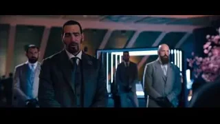man in suit in dimly lit room — John Wick: Chapter 4