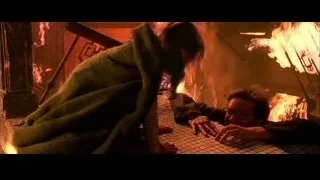 Man and woman by fireplace — Spider Man 2