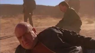 bald man in distress lying in desert — Breaking Bad