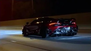 red sports car on race track at night — Sports Cars