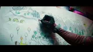 person drawing city map with Prisoner text — Deadpool 2