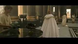 people in ancient Greek costumes in grand room — Gladiator 2