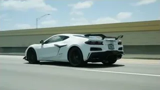 white sports car driving on highway — Sports Cars