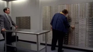 person in robe looking at metal lockers — Breaking Bad