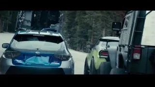 man leaning over blue car hood — Furious Seven