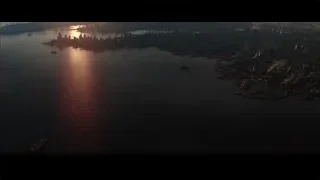 Aerial city skyline at sunset over water — Batman