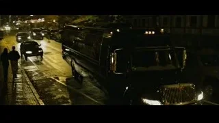 Black limousine parked on street at night — The Social Network