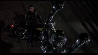 man on motorcycle in dark alleyway — Rocky III