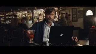 man at bar with laptop — The Big Short