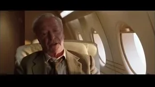 Elderly man sitting in airplane — Batman