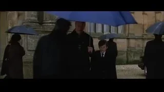 people walking in rain with umbrellas — Batman