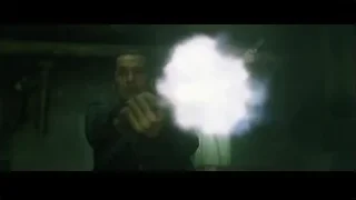 Man holding gun in dark foggy room — The Matrix