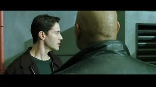 two men conversing by green wall — The Matrix