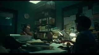 man and woman working at office desk — Joker