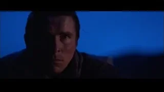close-up of man's face in dark — Batman