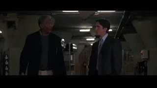 Two men walking in warehouse — Batman