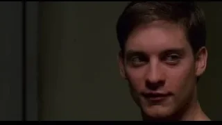 person's hand reaching out from black door — Spider Man