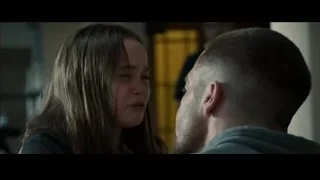 Upset young woman with man by yellow door — Southpaw