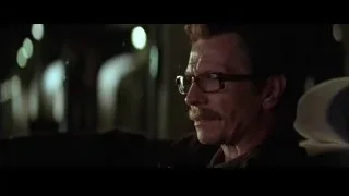 man with mustache looking away in dim room — Batman