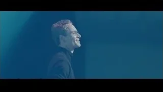 man on stage with eyes closed — Steve Jobs