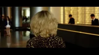 Woman at hotel reception desk — Lucy