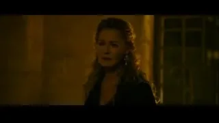 woman deep in thought in dimly lit stone room — Gladiator 2