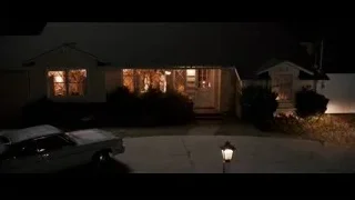 House lit up at night with cars — Jobs
