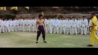 men in karate uniforms on grassy field — Bruce Lee: Enter The Dragon