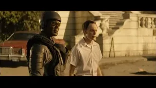 Two men on street, one with gun — Deadpool 2