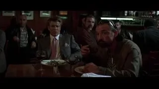 men eating and conversing in restaurant — Batman: The Dark Knight