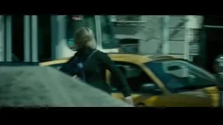 woman walking on street with taxi — Limitless