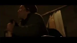 man holding microphone in dark room — Batman