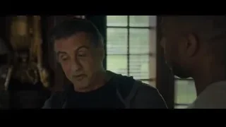 Two men standing in front of window — Creed 2