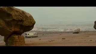 desert landscape with rock formation and RV — Into the Wild