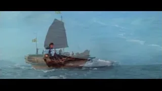People on wooden boat sailing on ocean — Bruce Lee: Enter The Dragon