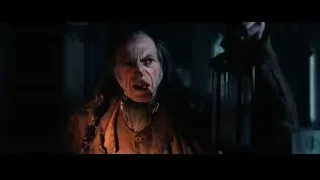 man in leather jacket holding lantern — Harry Potter and the Philosophers Stone