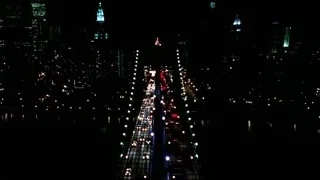 night city skyline with lights — Suits