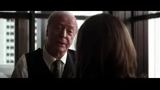 elderly man and woman by city window — Batman: The Dark Knight