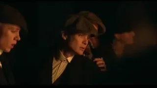 men in hats and suits in dimly lit room — Peaky Blinders
