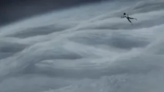 person skydiving over large wave — Weathering with You