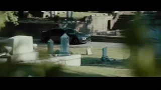 man with serious expression sitting in car — Furious Seven
