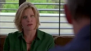 Woman on couch talking to man — Breaking Bad