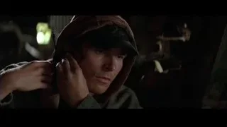 man in hoodie holding scissors — Batman
